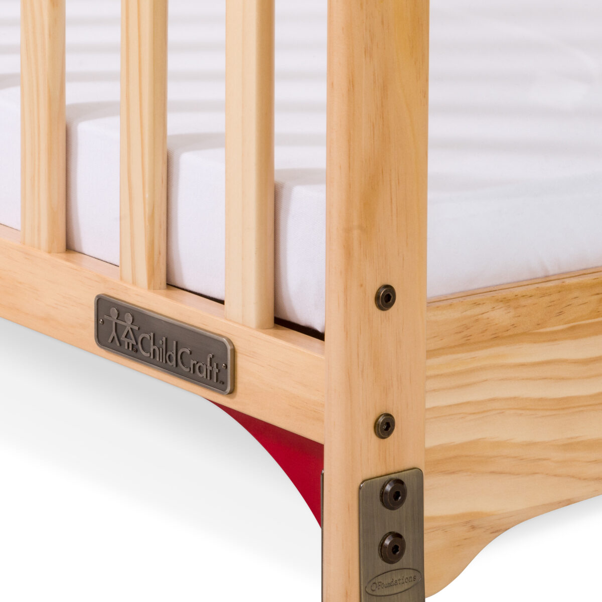 Three-inch mattress inside Child Craft Safe Haven crib